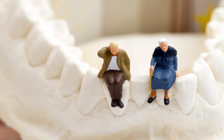Elderly couple sitting on a jaw bone