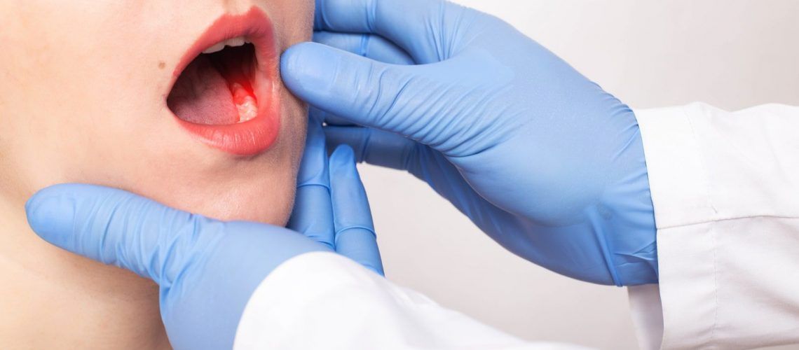 Woman get teeth examined